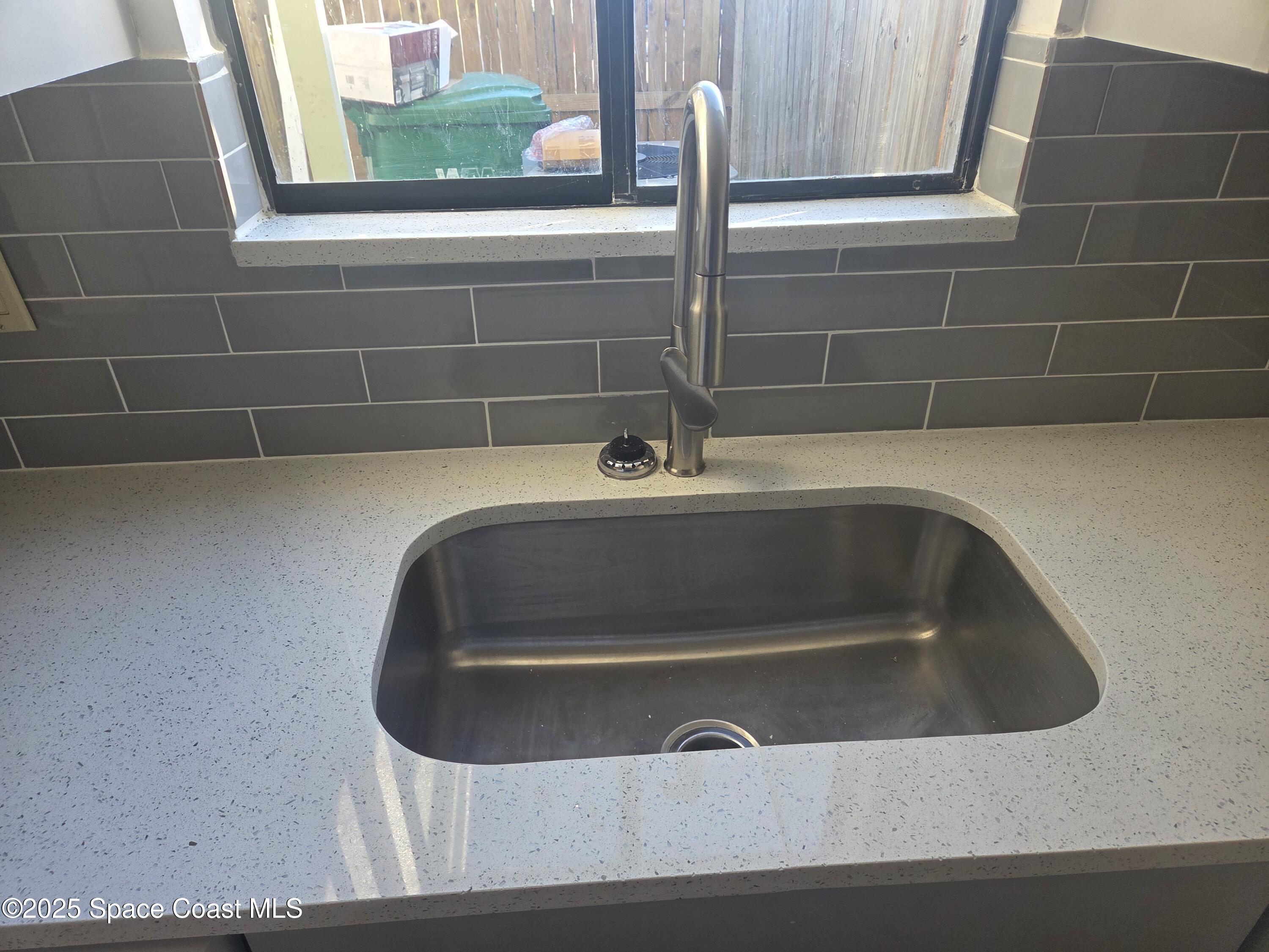 4611 Tree Ridge Lane Northeast Palm Bay, FL 32905 - Photo 4 of 7 a bathroom with a sink