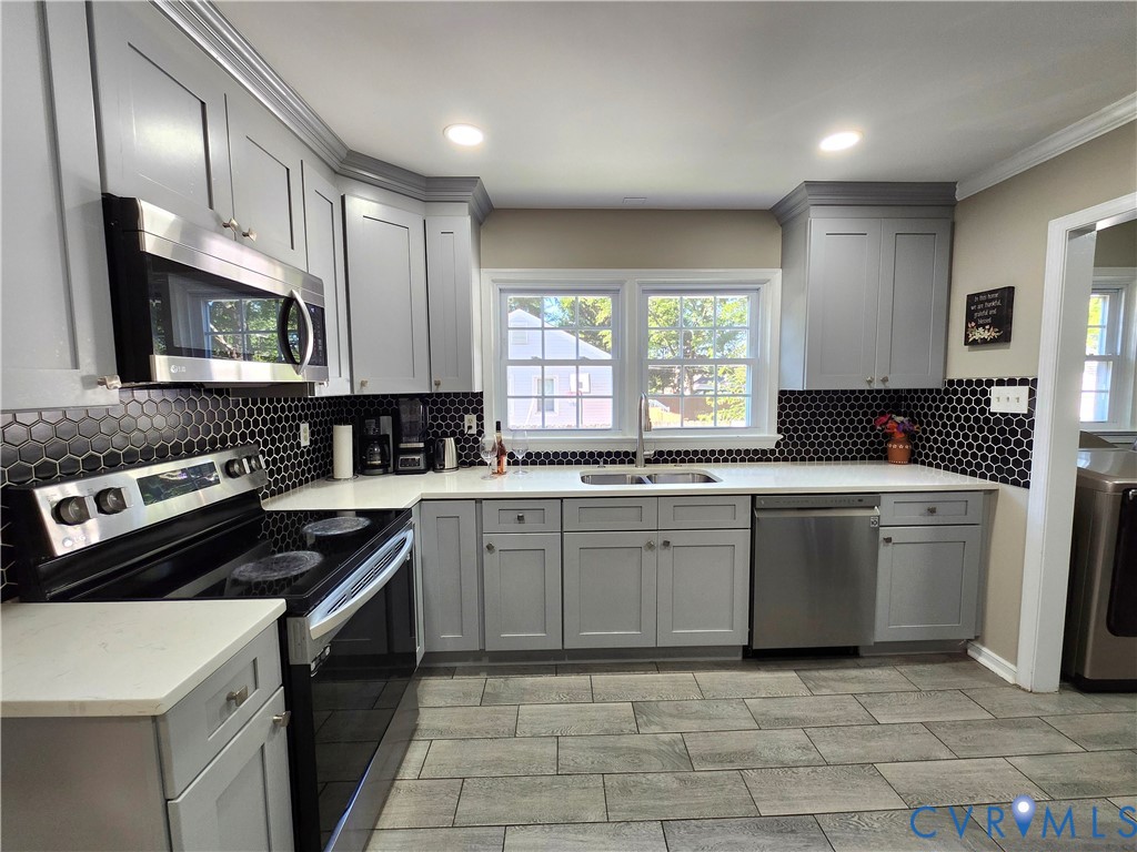 2718 Stacie Road Richmond, VA 23224 - Photo 9 of 50 Modern kitchen featuring grey shaker-style cabinet