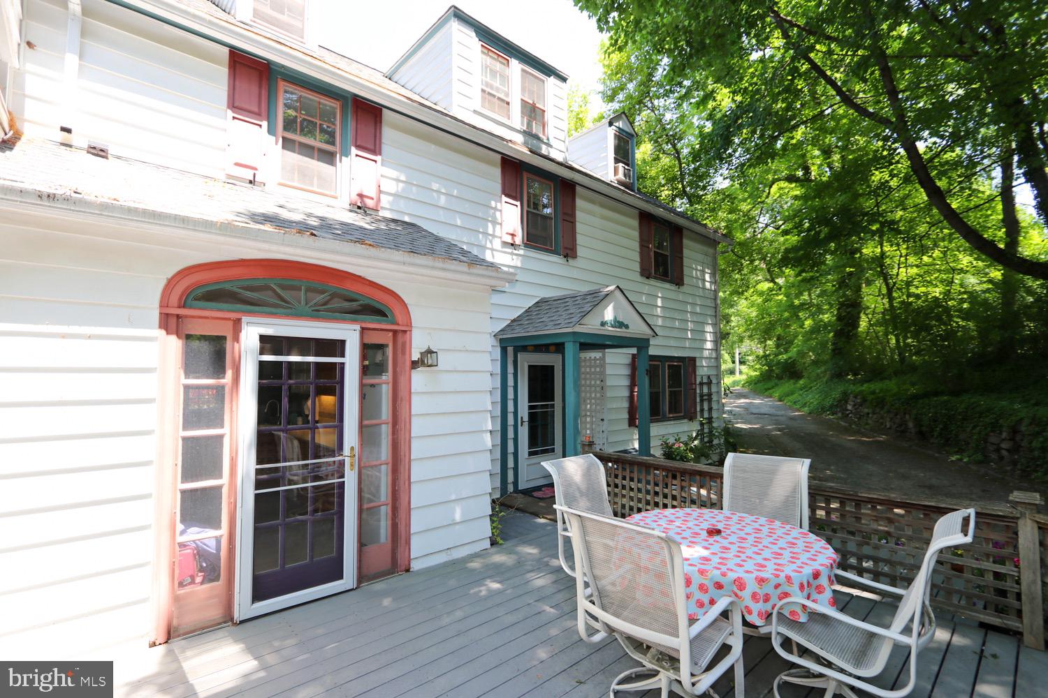 2701 Alden Road Bryn Athyn, PA 19006 - Photo 98 of 105 a view of a patio with table and chairs and wooden floor