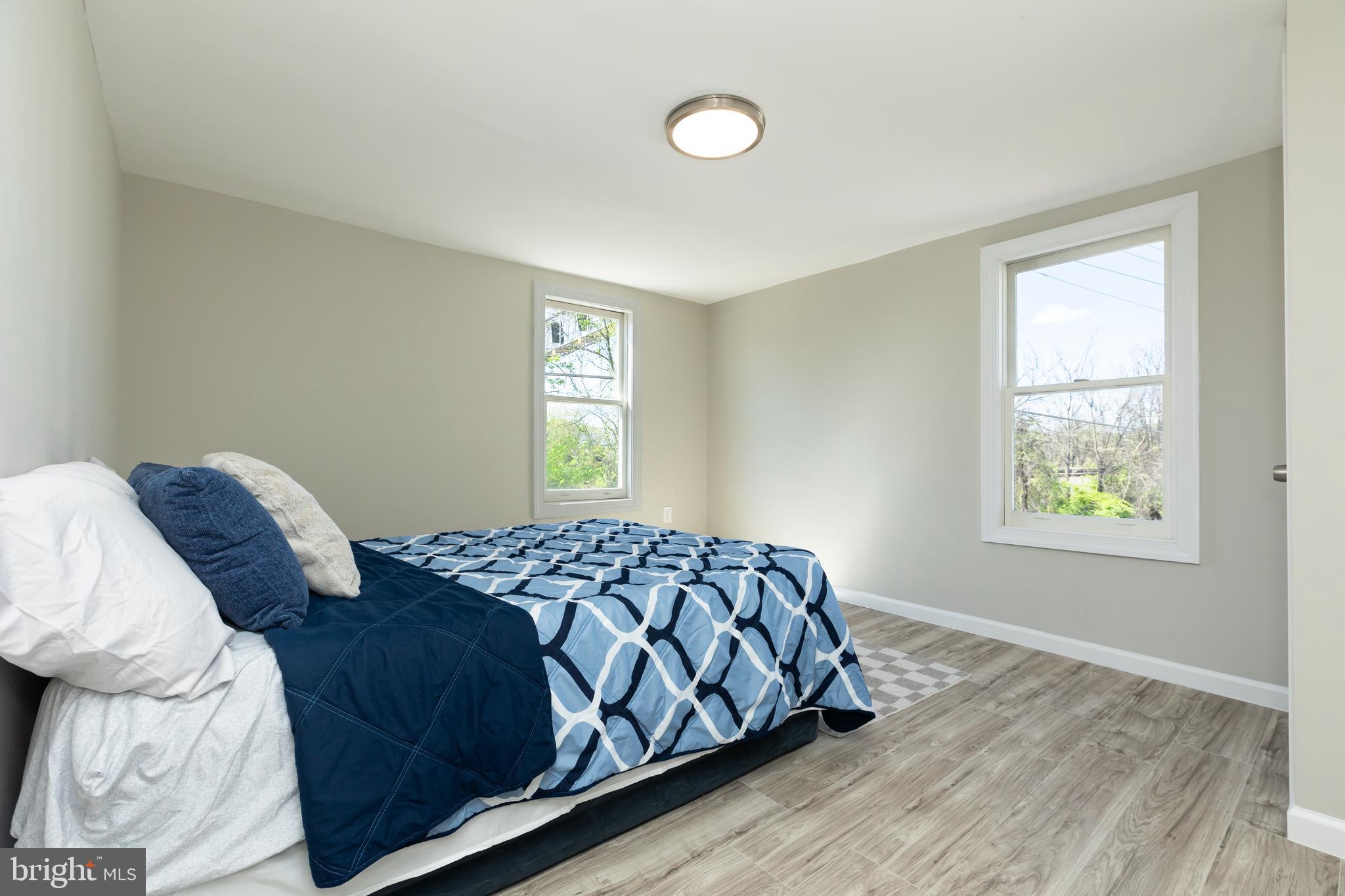 2407 Hammonds Ferry Road Halethorpe, MD 21227 - Photo 30 of 43 a bedroom with a bed and a window