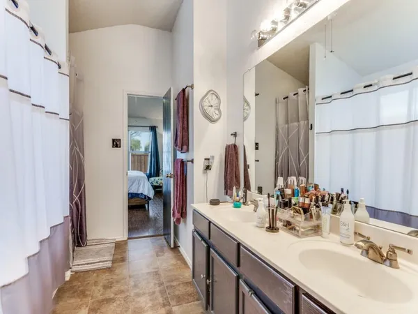 a bathroom with a sink vanity and a mirror