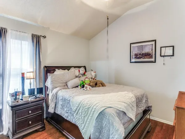 a bedroom with bed and window