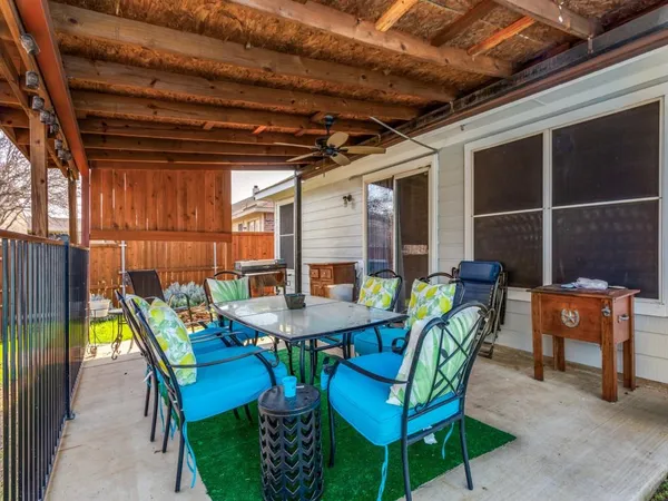 a view of a table and chairs in patio