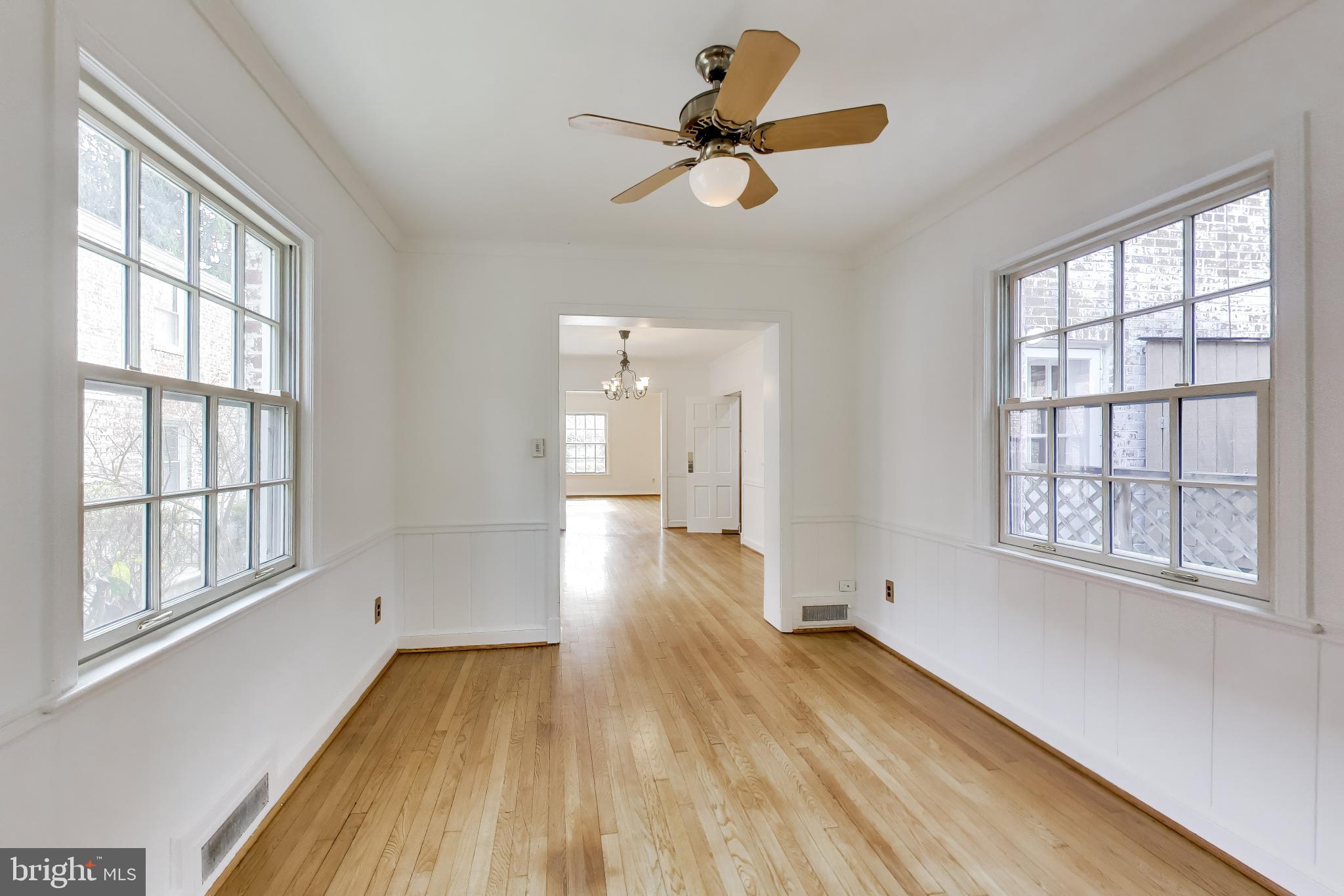 5138 Nebraska Avenue Northwest Washington, DC 20008 - Photo 12 of 39 a view of empty room with wooden floor and windows