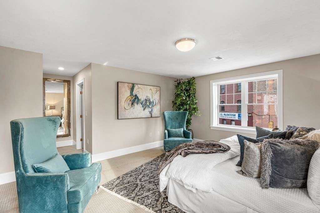 2 Audubon Way, Unit 2 Canton, MA 02021 - Photo 6 of 12 a living room with furniture and a large window