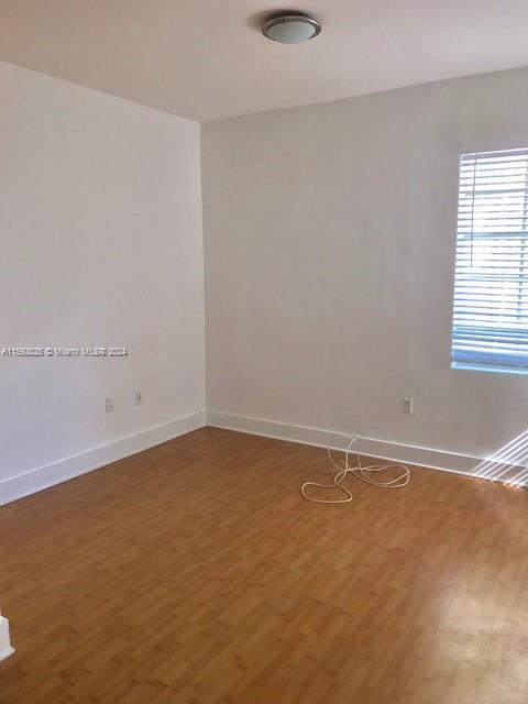 1000 Meridian Avenue, Unit 2 Miami Beach, FL 33139 - Photo 12 of 12 an empty room with a window