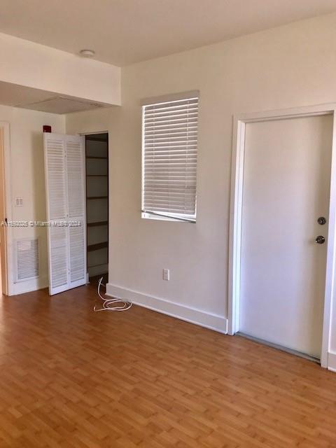 1000 Meridian Avenue, Unit 2 Miami Beach, FL 33139 - Photo 8 of 12 a view of an empty room with closet and a window
