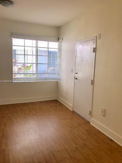 1000 Meridian Avenue, Unit 2 Miami Beach, FL 33139 - Photo 9 of 12 an empty room with a window