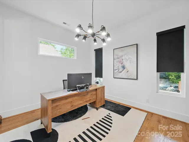 a workspace with furniture and window