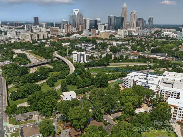 a aerial view of a house with a yard