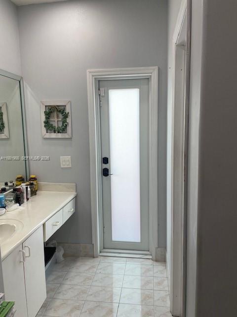 18214 Southwest 144th Place Miami, FL 33177 - Photo 13 of 20 a view of a bathroom with a sink and mirror