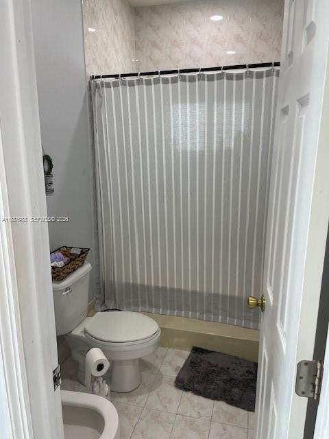 18214 Southwest 144th Place Miami, FL 33177 - Photo 14 of 20 a bathroom with a toilet and a shower