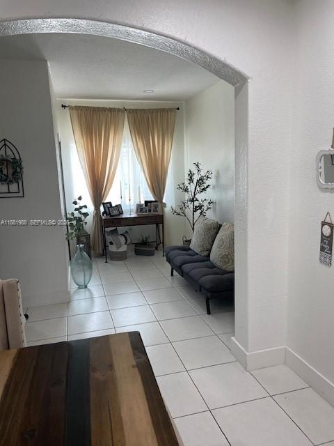 18214 Southwest 144th Place Miami, FL 33177 - Photo 4 of 20 a living room with a couch and a table