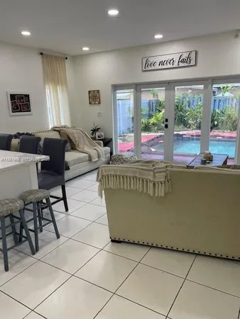 a living room with furniture and window