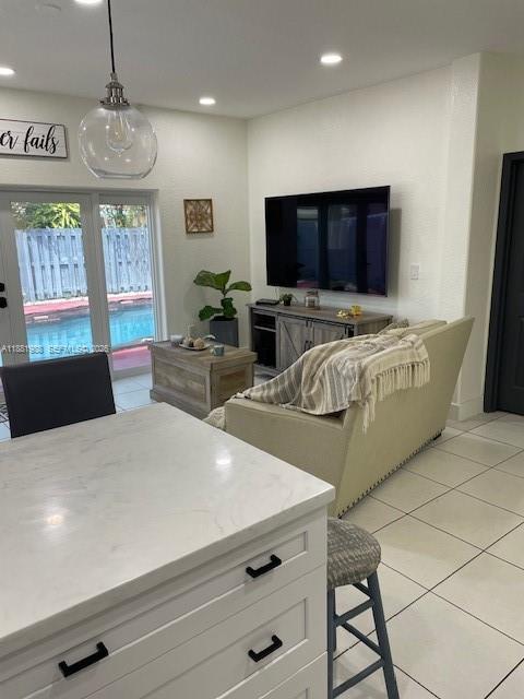 18214 Southwest 144th Place Miami, FL 33177 - Photo 7 of 20 a living room with furniture and a flat screen tv