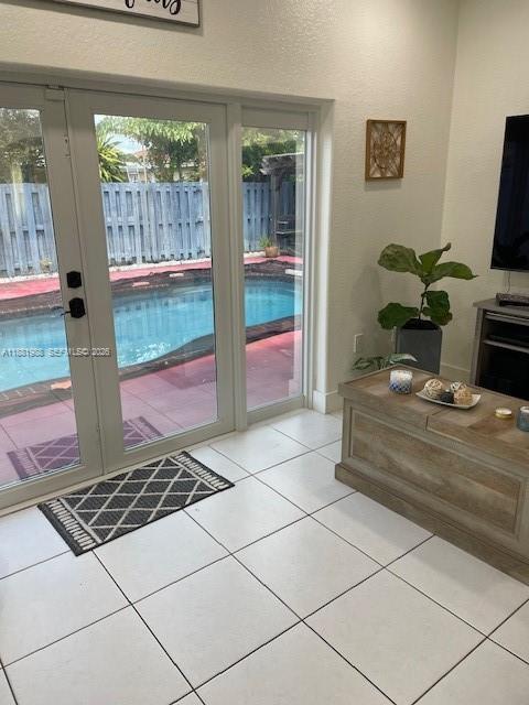 18214 Southwest 144th Place Miami, FL 33177 - Photo 10 of 20 a room with a couch a rug and a window