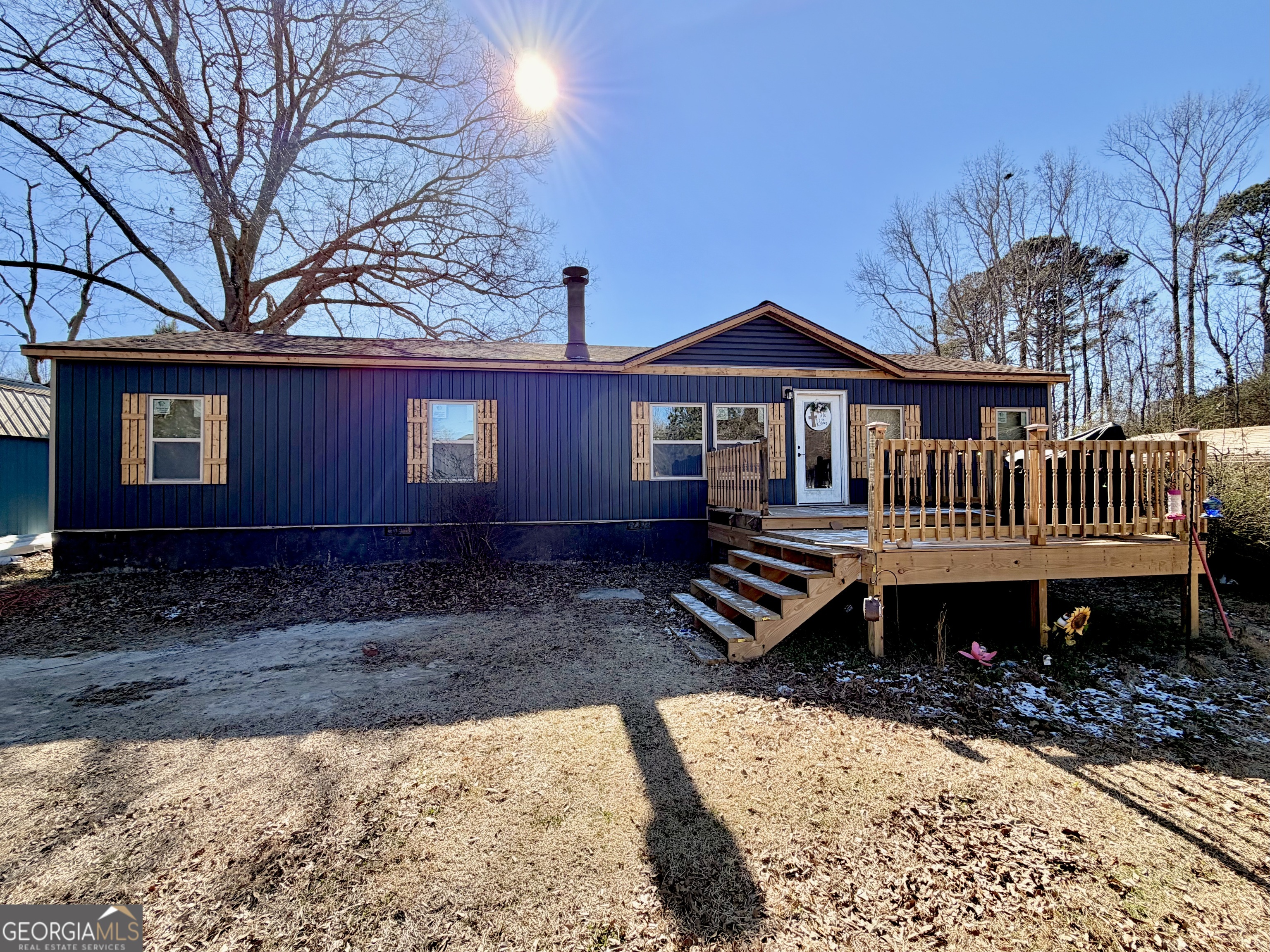 5448 Blanton Mill Road Williamson, GA 30292 - Photo 1 of 50 a front view of a house with garden and deck