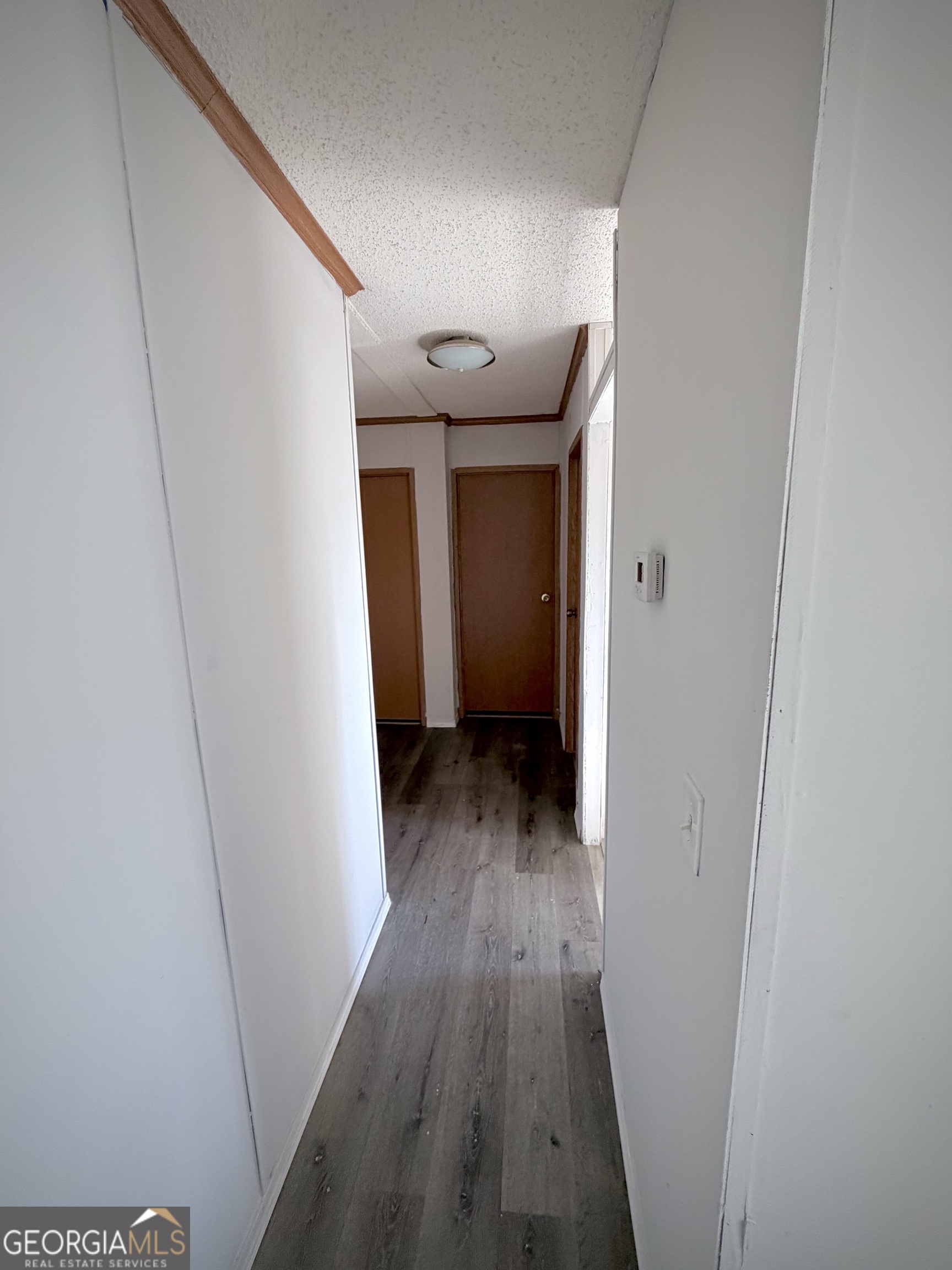 5448 Blanton Mill Road Williamson, GA 30292 - Photo 18 of 50 a view of a hallway with wooden floor
