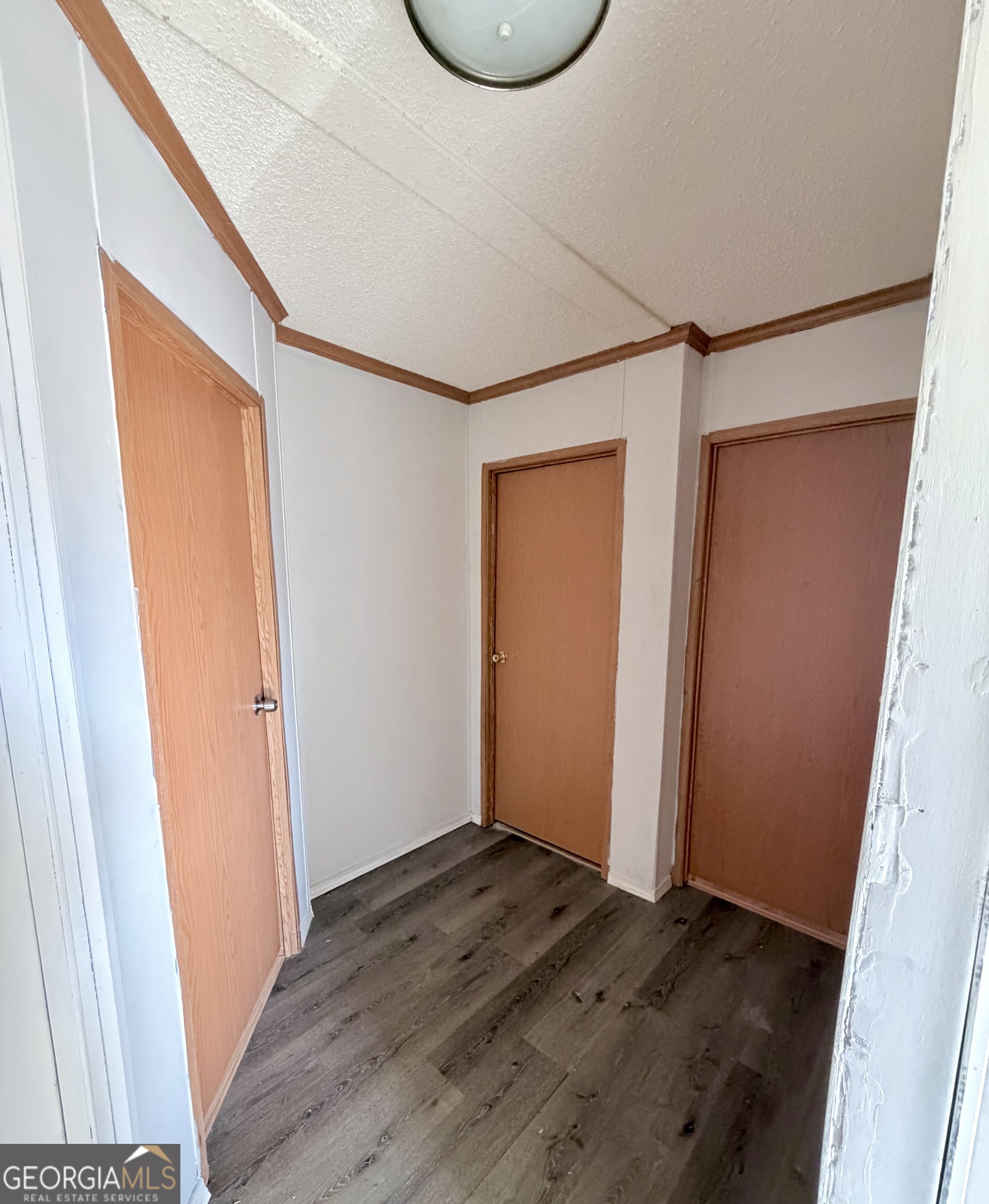 5448 Blanton Mill Road Williamson, GA 30292 - Photo 20 of 50 an empty room with wooden floor and window