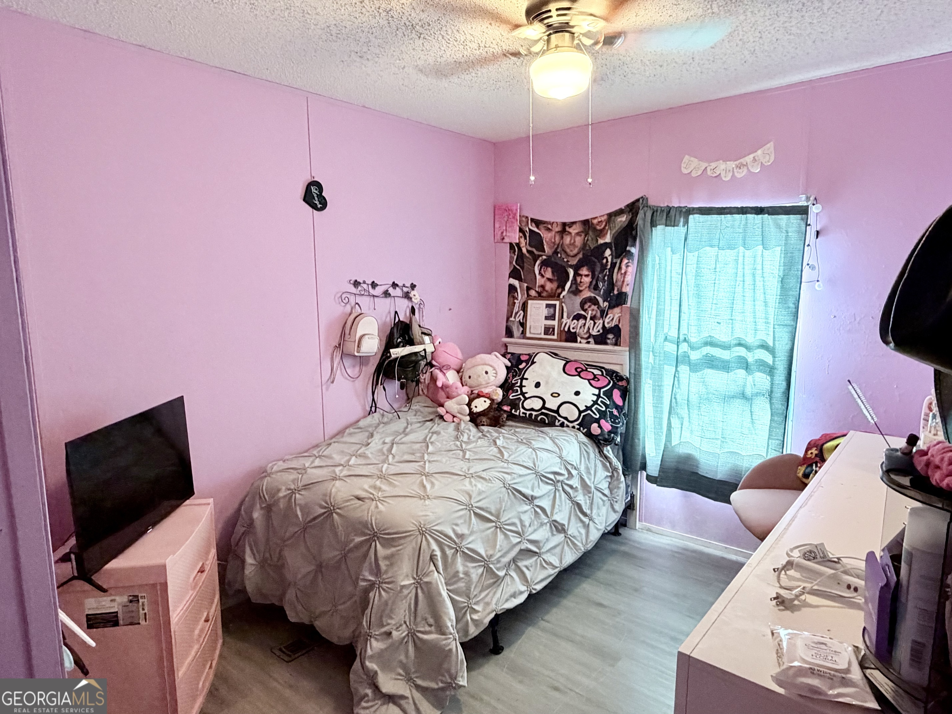 5448 Blanton Mill Road Williamson, GA 30292 - Photo 21 of 50 a bedroom with a bed and a flat screen tv