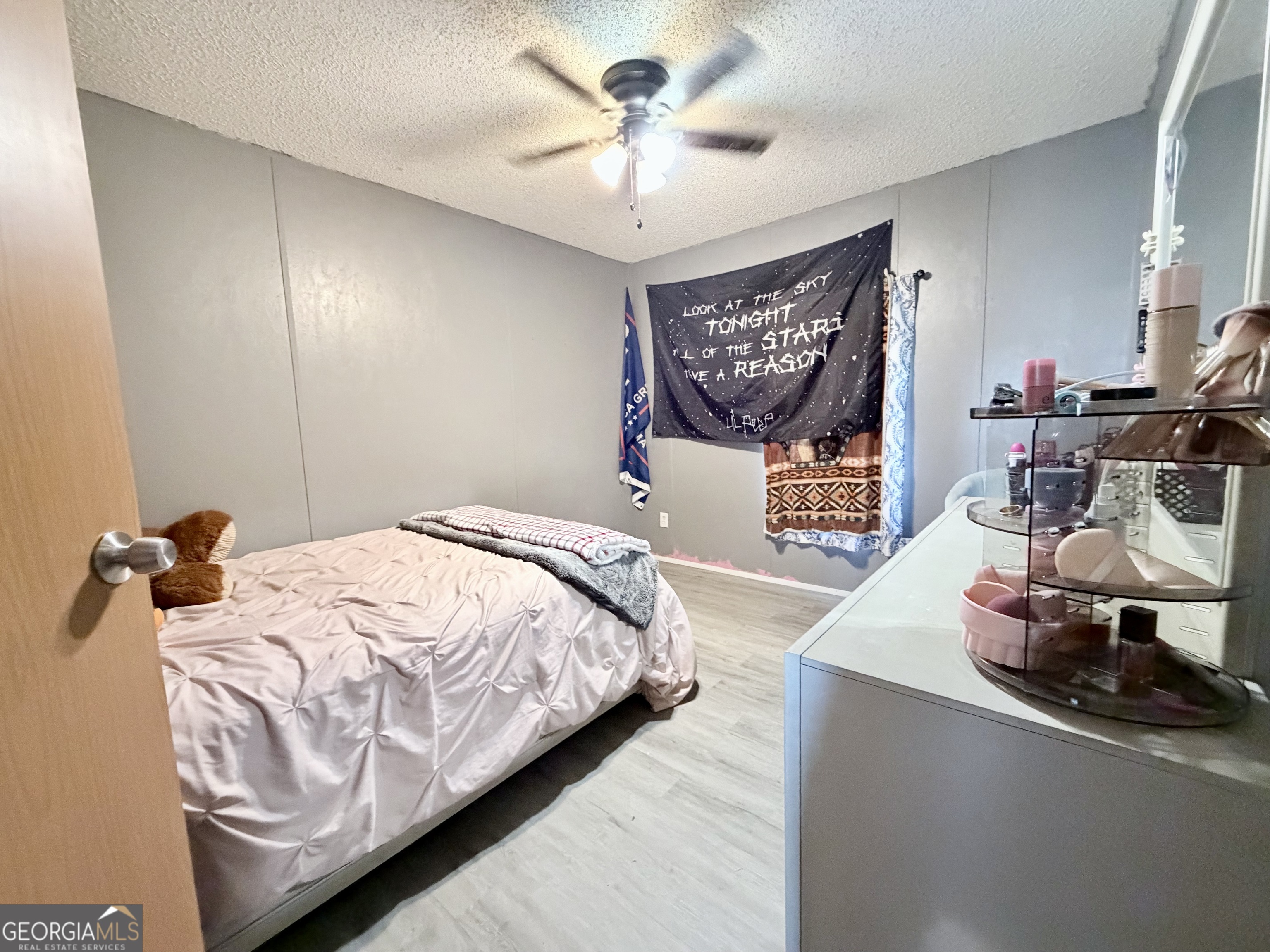 5448 Blanton Mill Road Williamson, GA 30292 - Photo 24 of 50 a bedroom with a bed and a chandelier