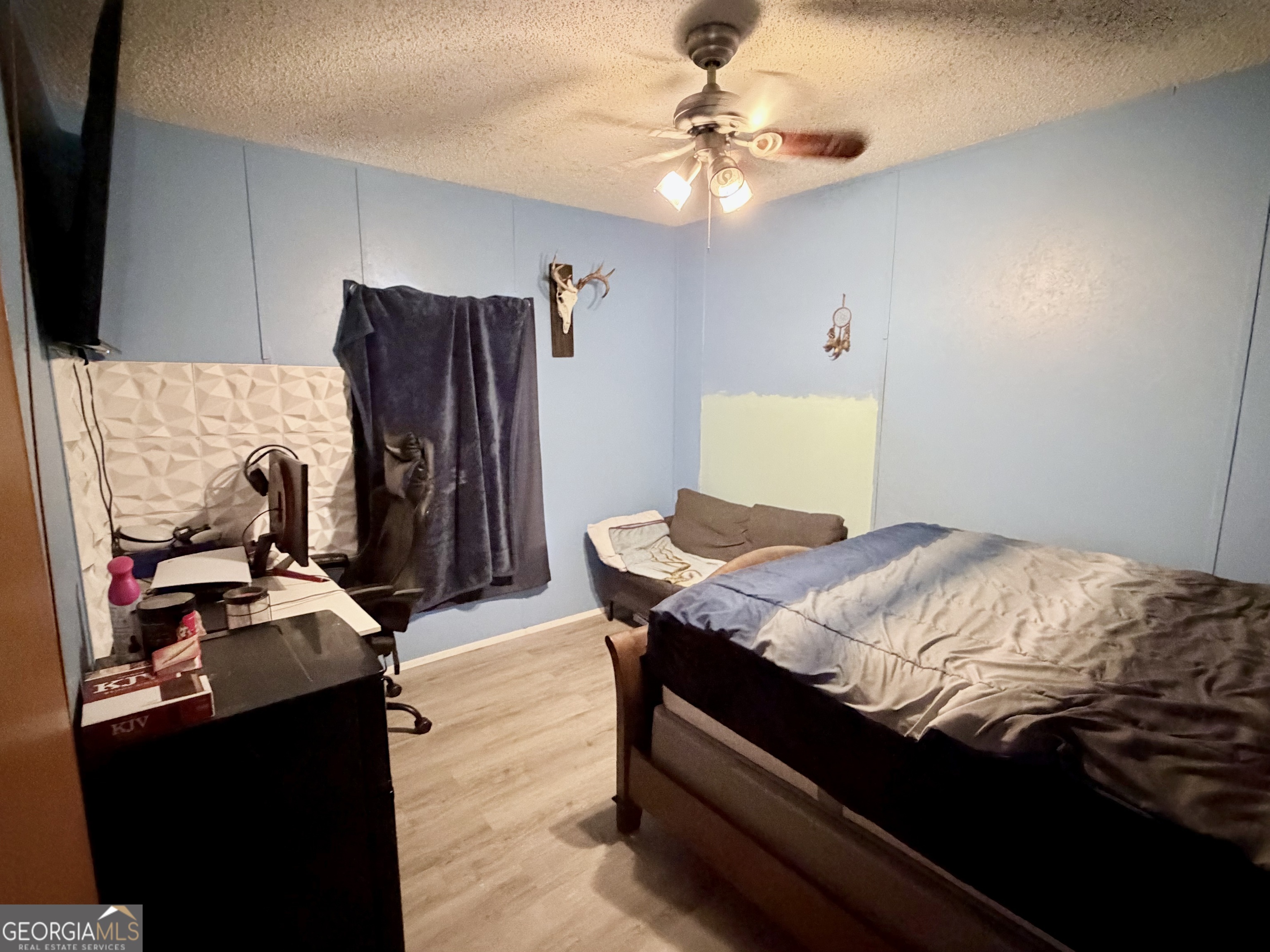 5448 Blanton Mill Road Williamson, GA 30292 - Photo 25 of 50 a bed sitting in a bedroom next to a window