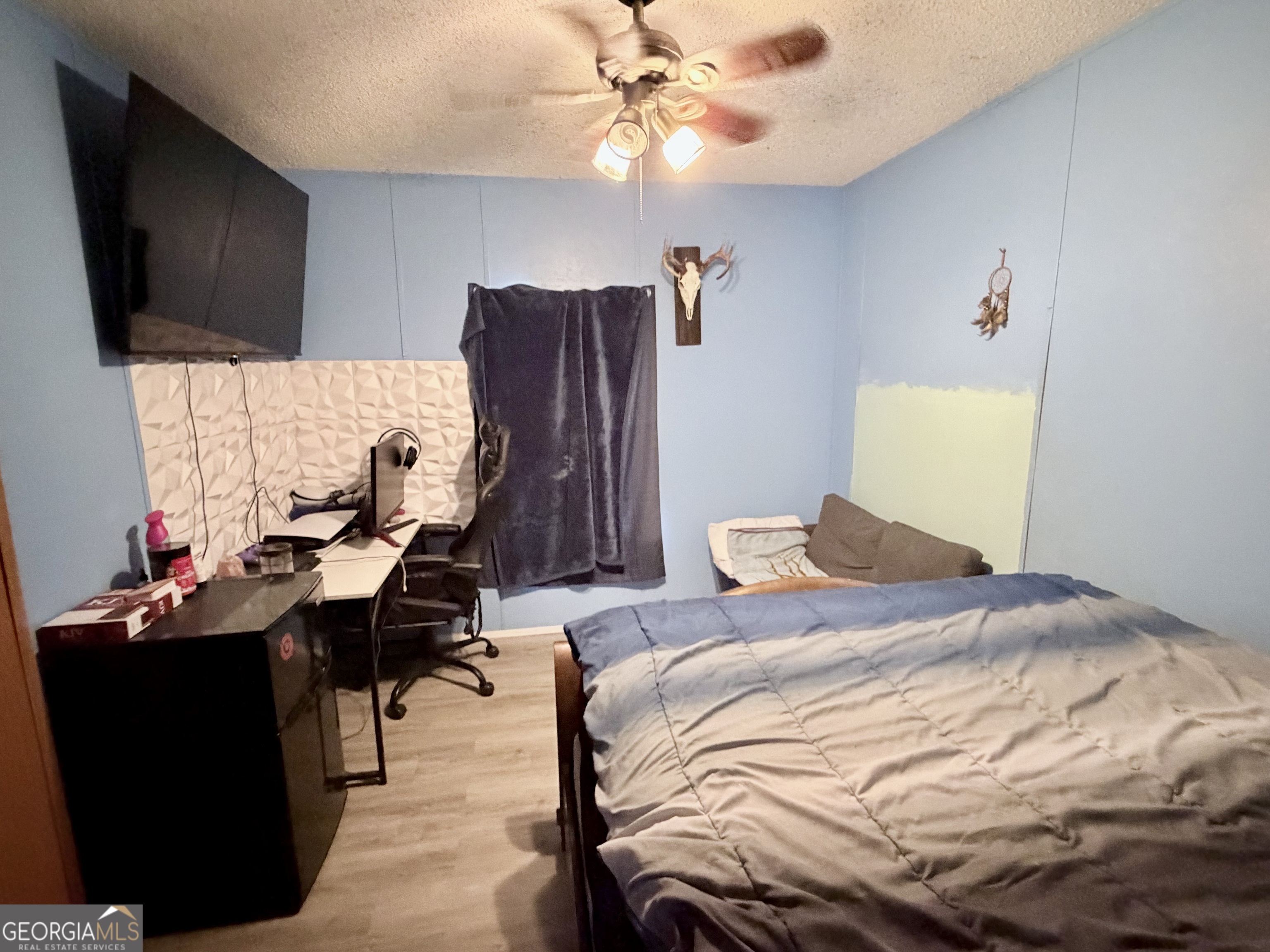 5448 Blanton Mill Road Williamson, GA 30292 - Photo 26 of 50 a bedroom that has a bed and a flat screen tv