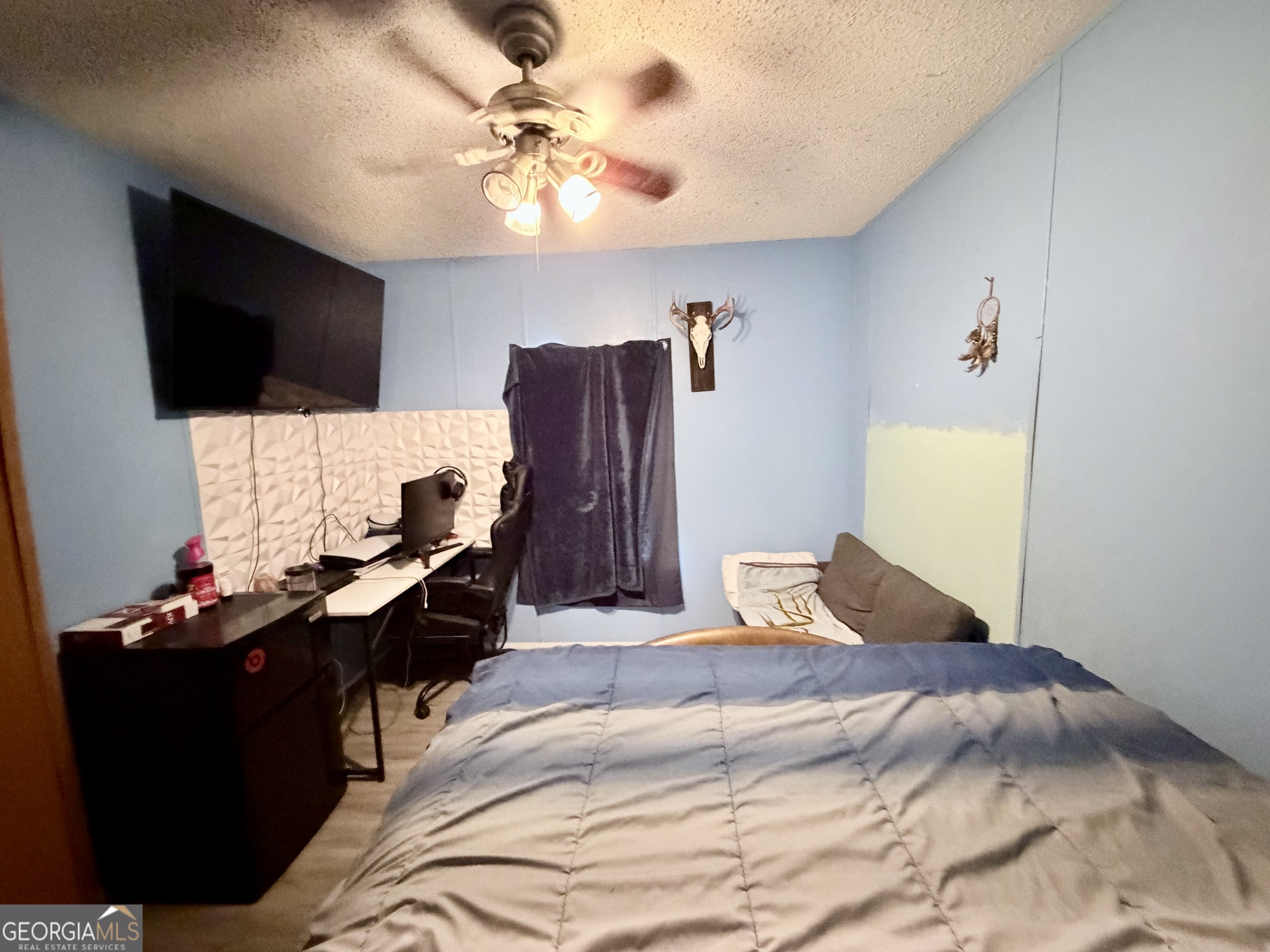 5448 Blanton Mill Road Williamson, GA 30292 - Photo 28 of 50 a bedroom with a bed and a flat screen tv