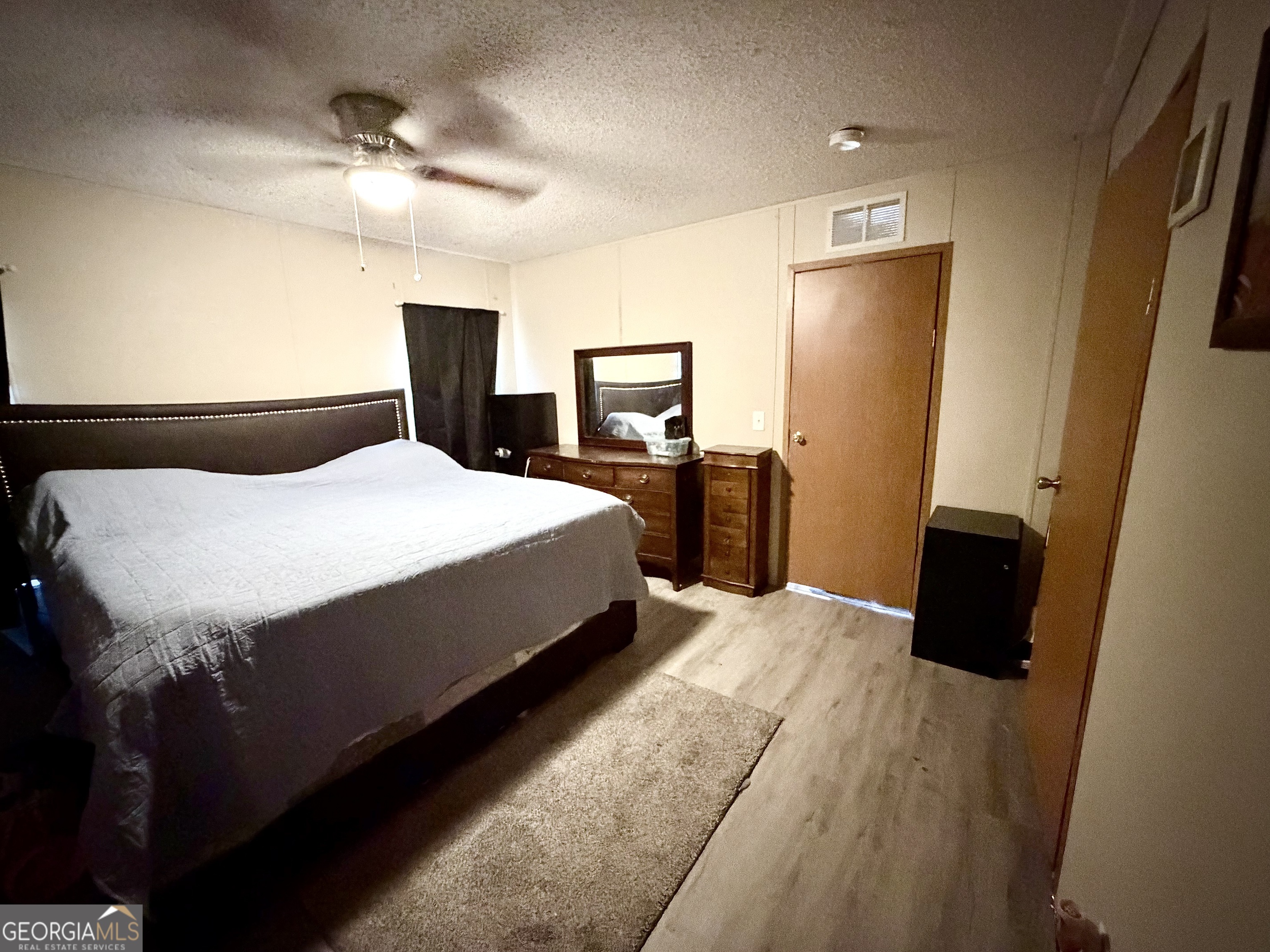 5448 Blanton Mill Road Williamson, GA 30292 - Photo 33 of 50 a bedroom with a bed and a dresser