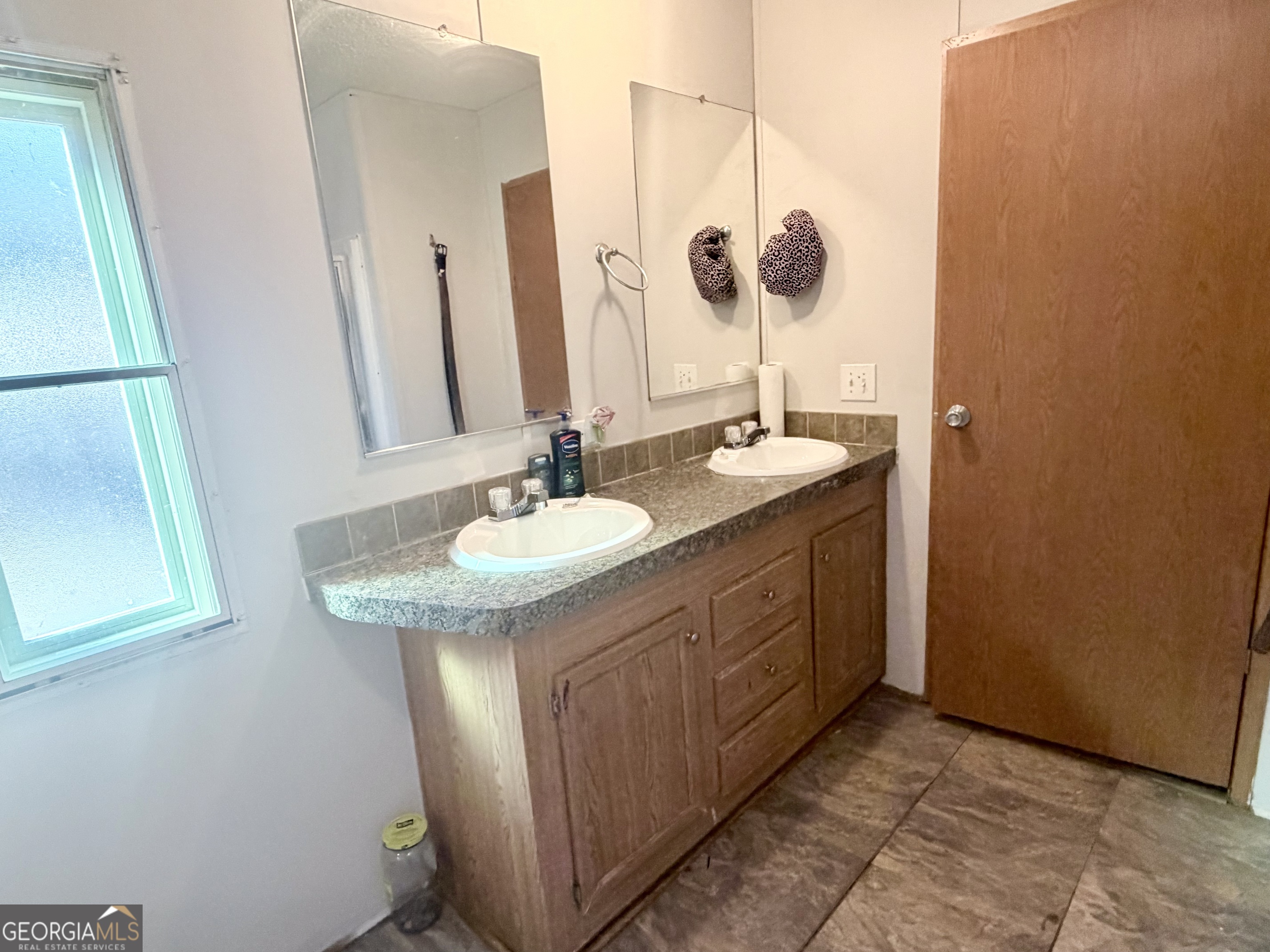 5448 Blanton Mill Road Williamson, GA 30292 - Photo 39 of 50 a bathroom with a sink and a mirror