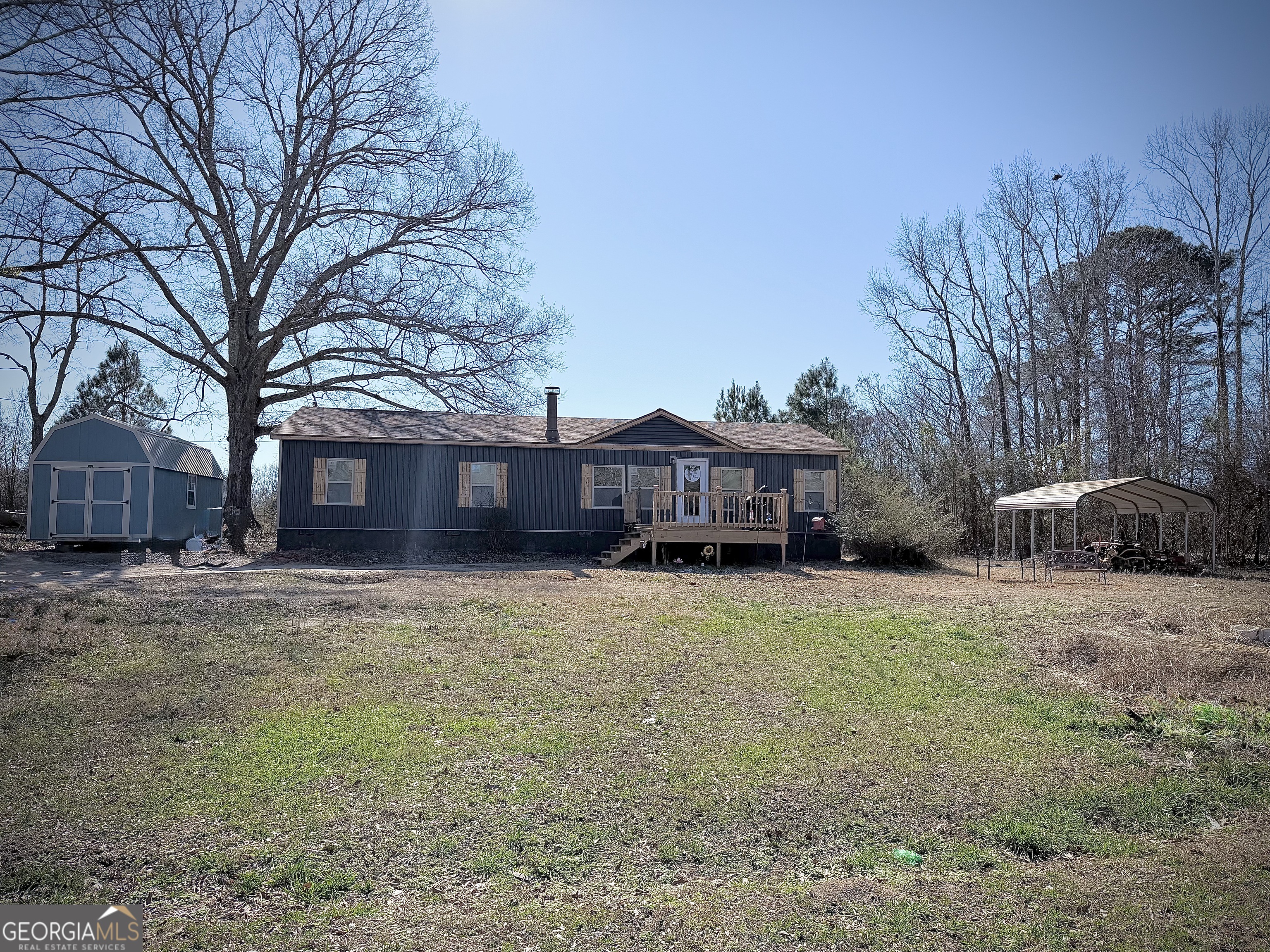 5448 Blanton Mill Road Williamson, GA 30292 - Photo 40 of 50 a view of a house with a yard