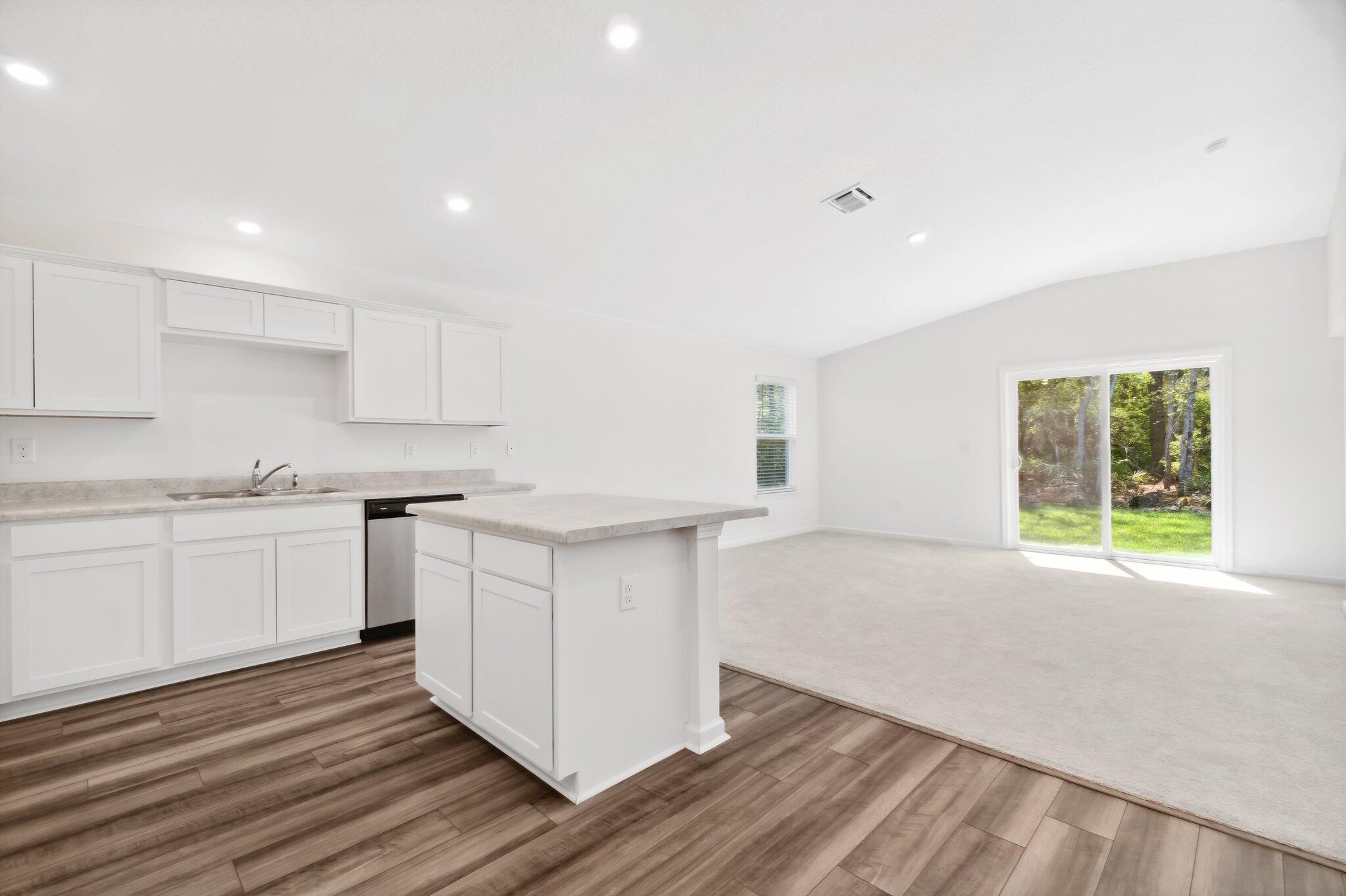 720 Riverwalk Circle Freeport, FL 32439 - Photo 15 of 34 a kitchen with a sink cabinets and window