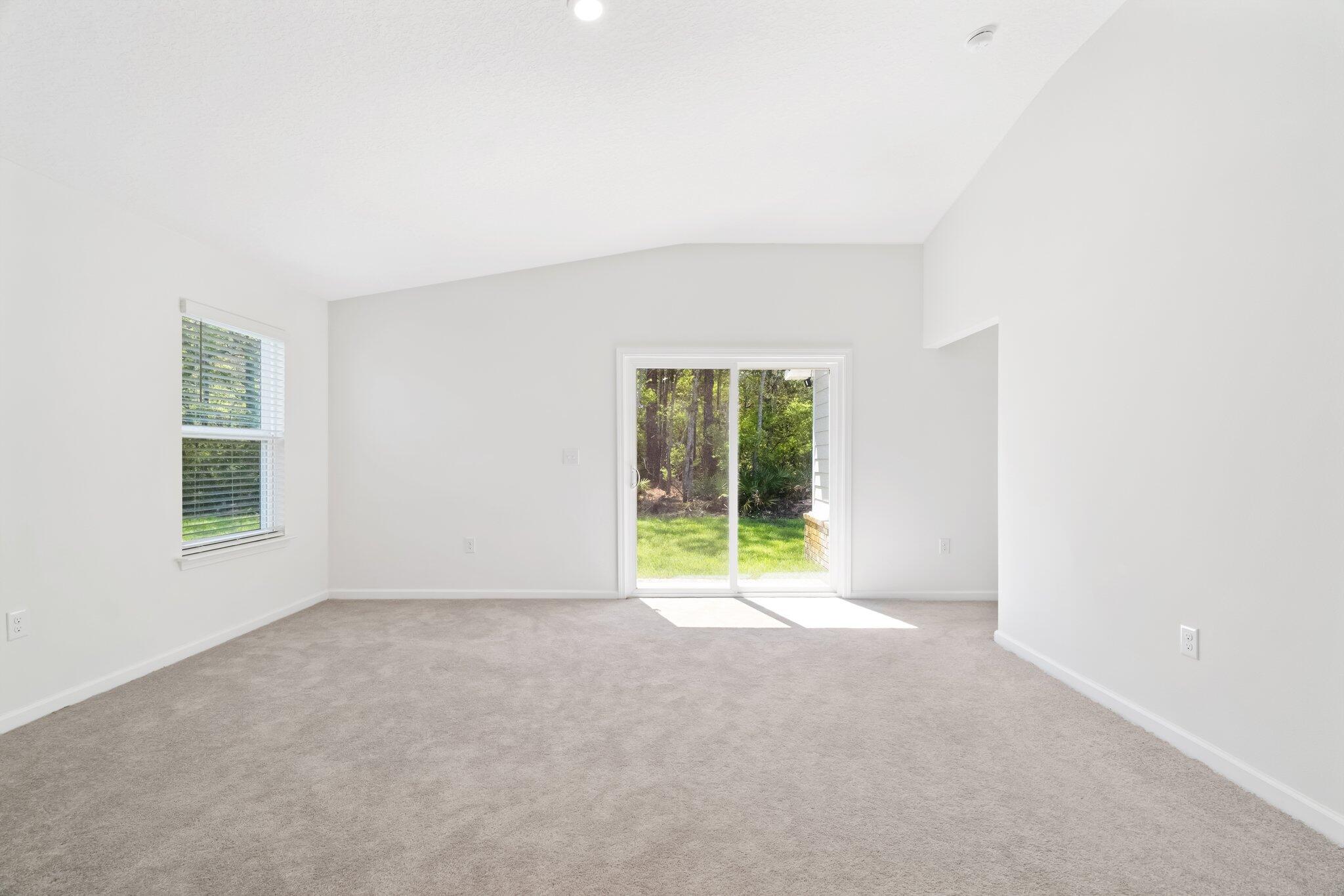 720 Riverwalk Circle Freeport, FL 32439 - Photo 19 of 34 a view of an empty room with a window