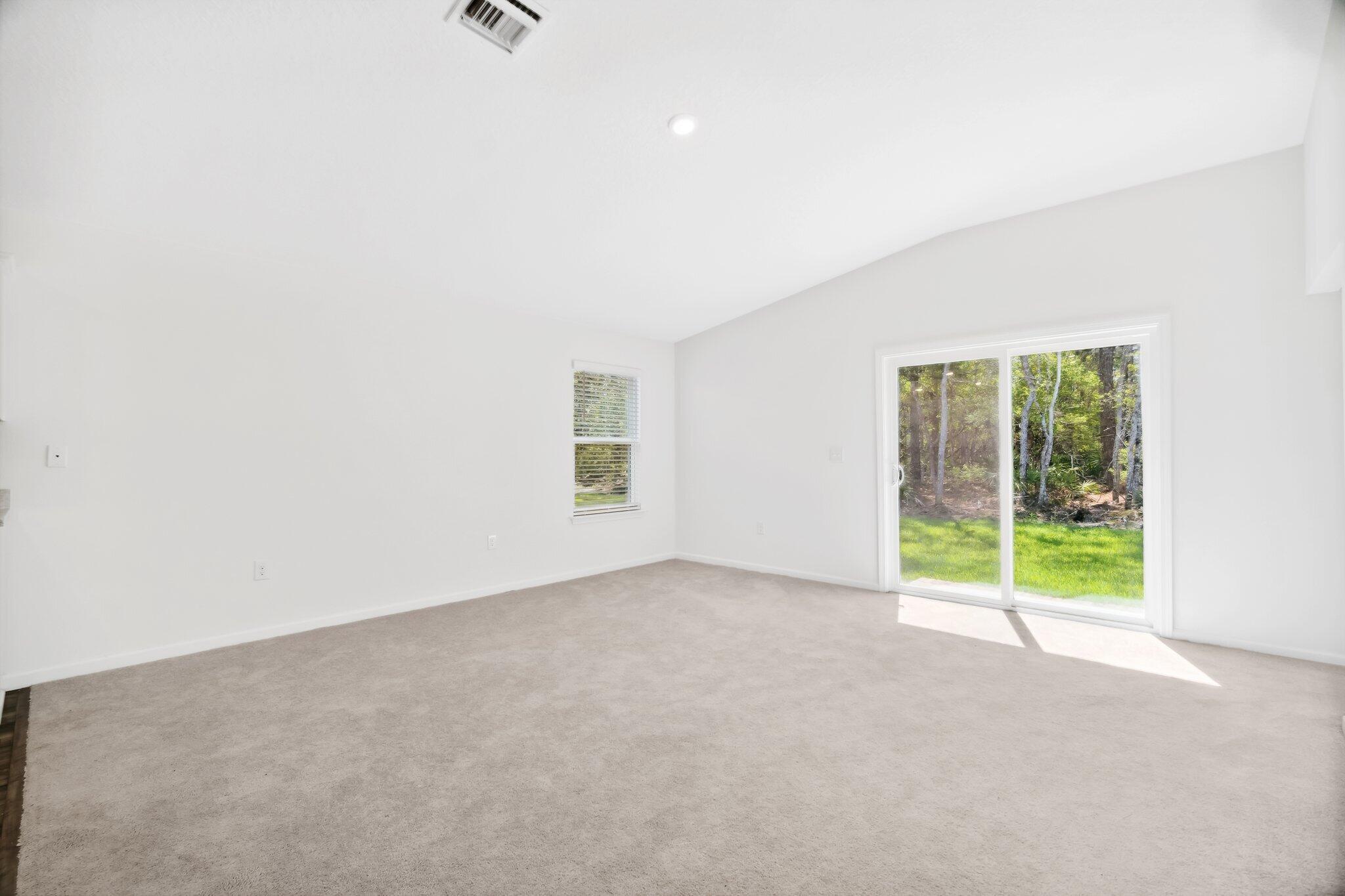 720 Riverwalk Circle Freeport, FL 32439 - Photo 20 of 34 an empty room with windows