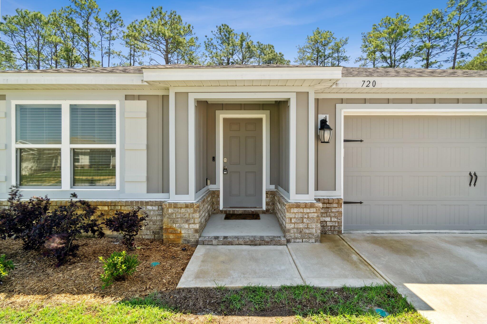 720 Riverwalk Circle Freeport, FL 32439 - Photo 3 of 34 front view of a house