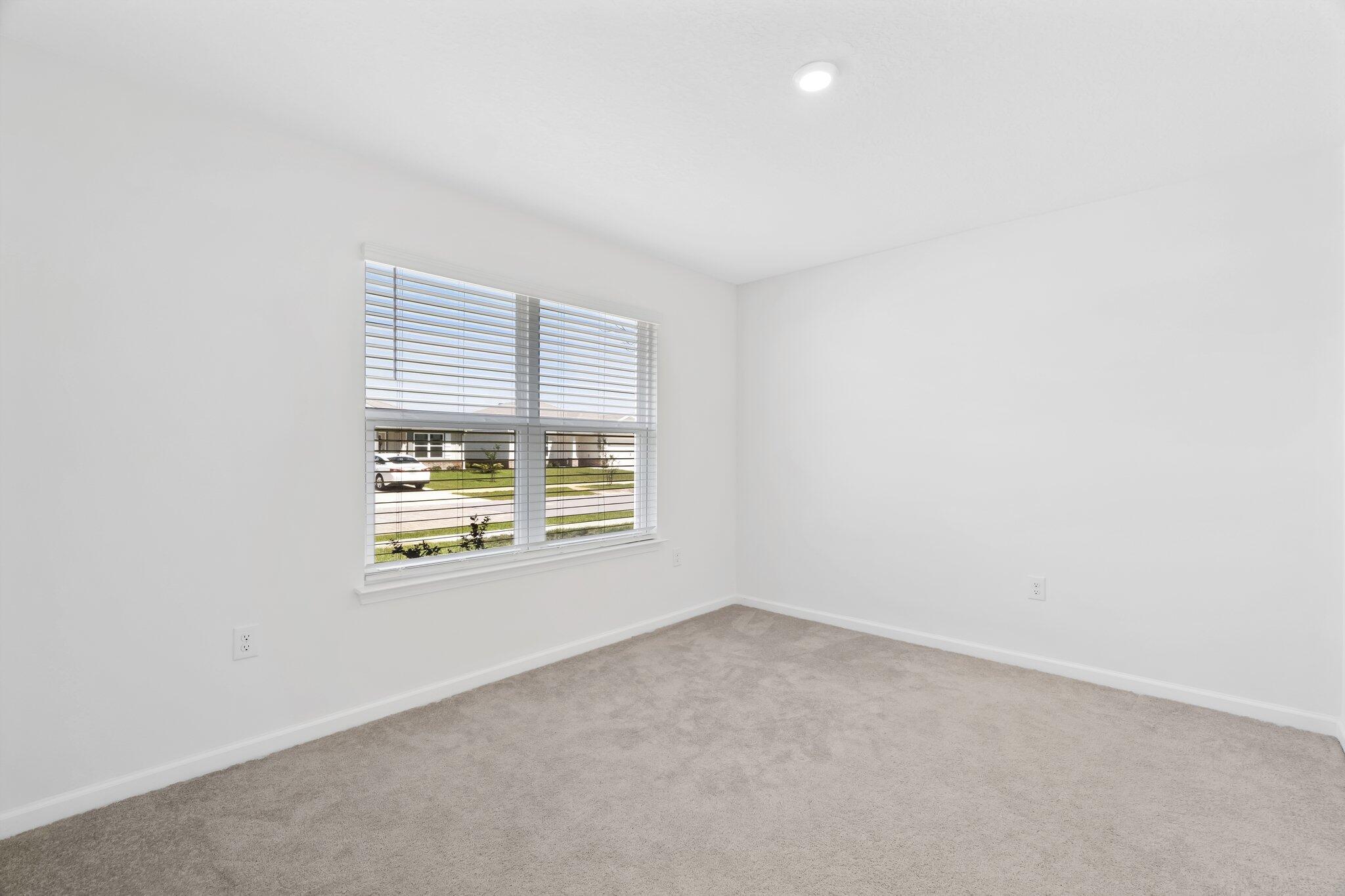 720 Riverwalk Circle Freeport, FL 32439 - Photo 5 of 34 an empty room with a window