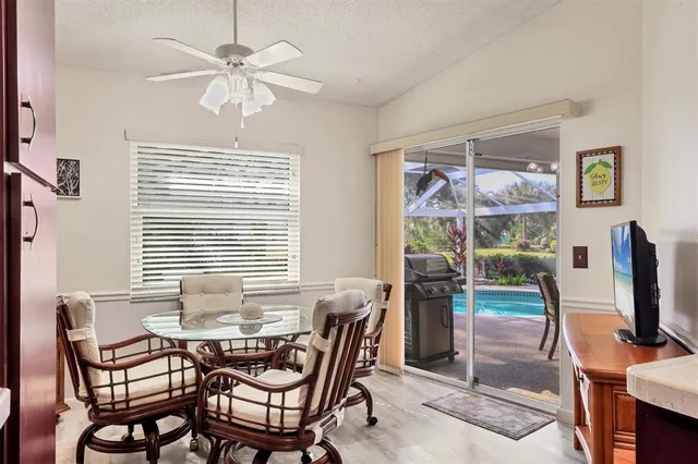a dining room with furniture and window
