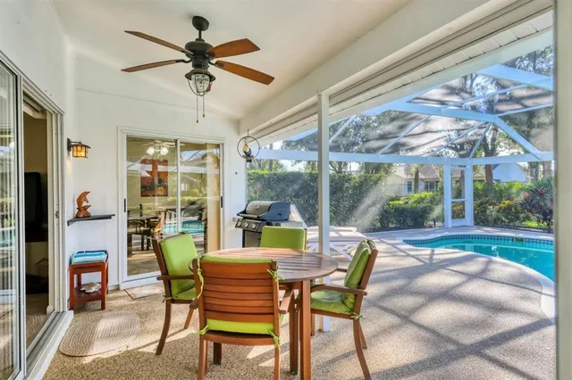 a view of a dining room with furniture wooden floor and a chandelier