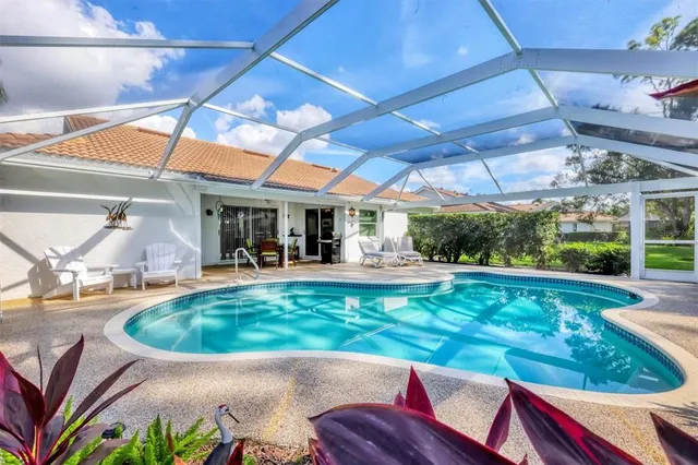 a view of a swimming pool with a patio