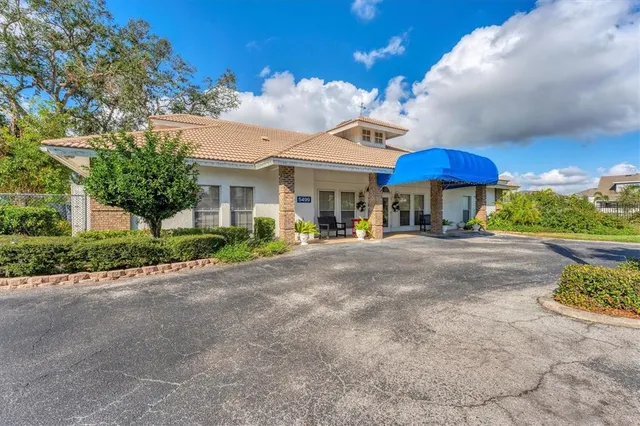 a view of dining room with furniture and wooden floor
