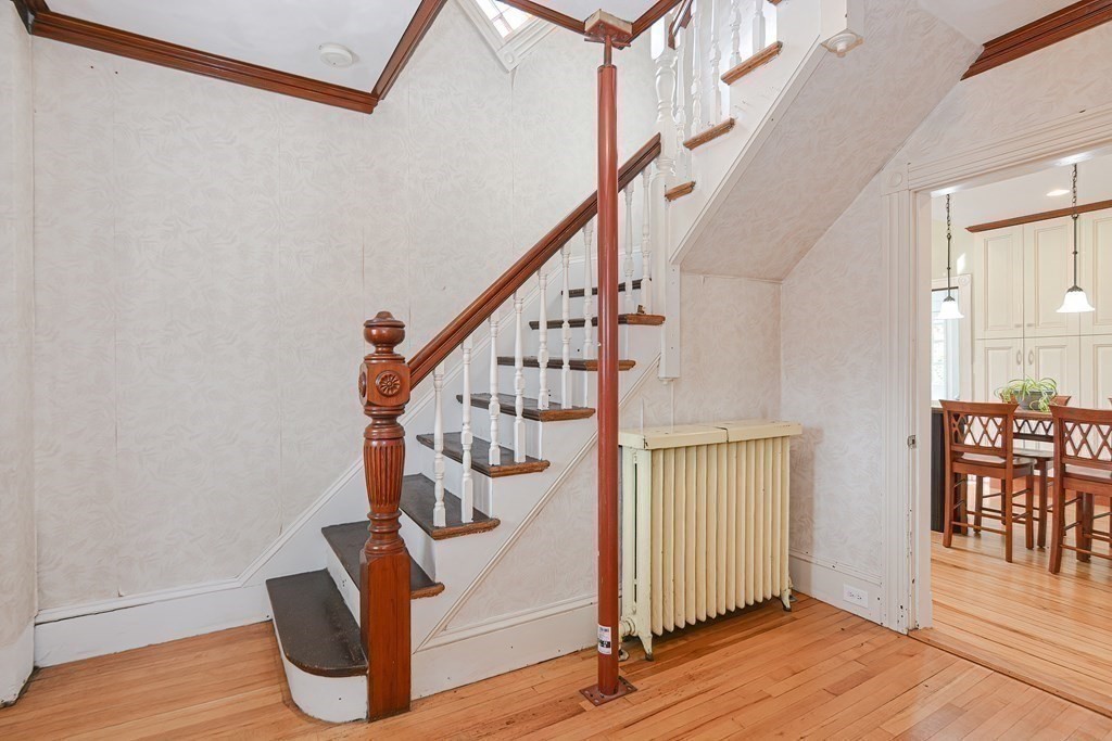83 Eliot Street Natick, MA 01760 - Photo 21 of 42 a view of entryway with wooden floor and stairs