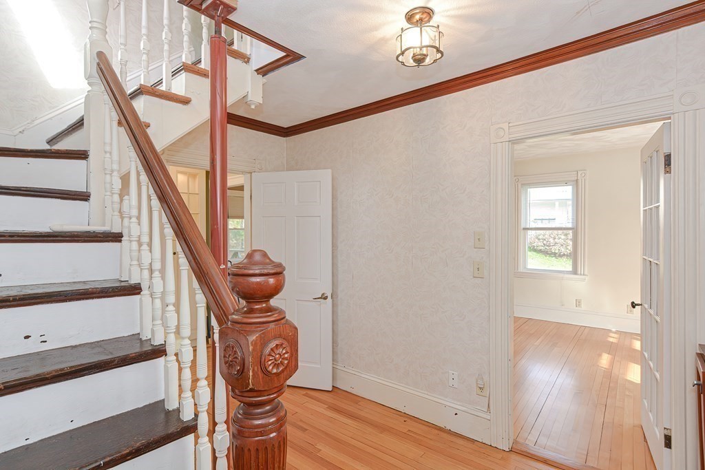 83 Eliot Street Natick, MA 01760 - Photo 23 of 42 a view of entryway with wooden floor