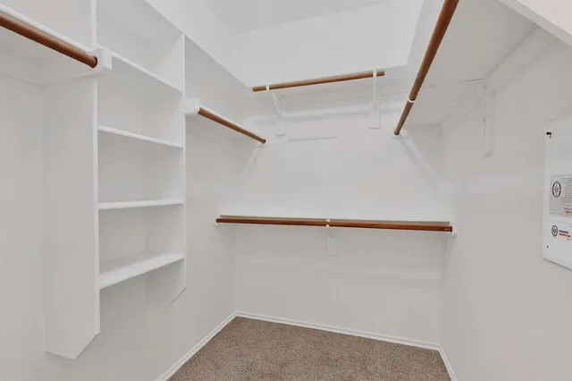 a view of an empty walk in closet