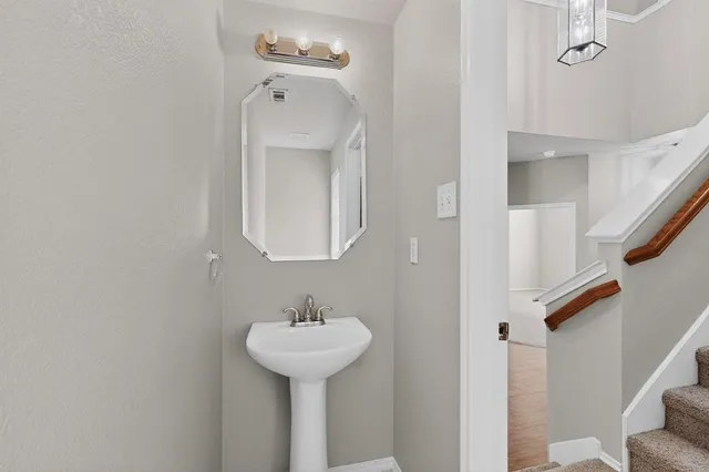 a bathroom with a sink and mirror
