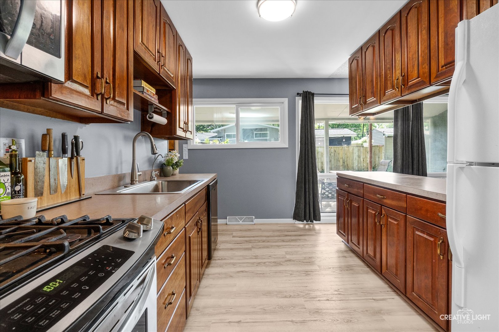 4 Woodcliff Road Montgomery, IL 60538 - Photo 5 of 18 a kitchen with stainless steel appliances granite countertop a stove and a sink