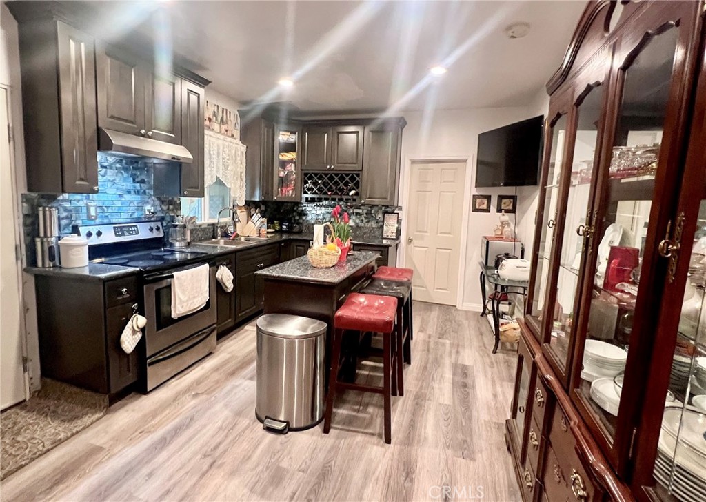 1166 El Mirage Road Adelanto, CA 92301 - Photo 13 of 21 a view of a dining room with furniture a rug wooden floor and a rug
