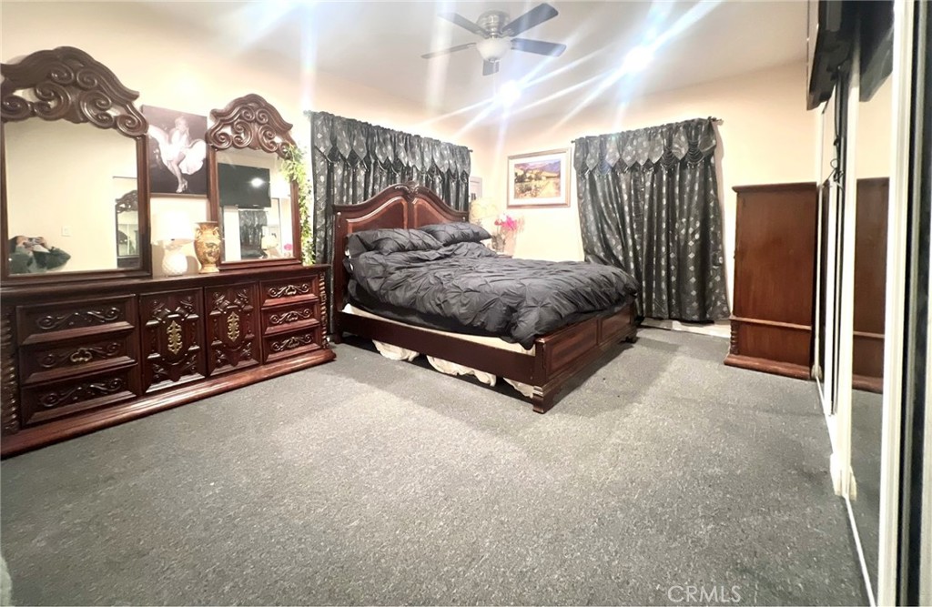 1166 El Mirage Road Adelanto, CA 92301 - Photo 16 of 21 a spacious bedroom with a bed dresser and a window