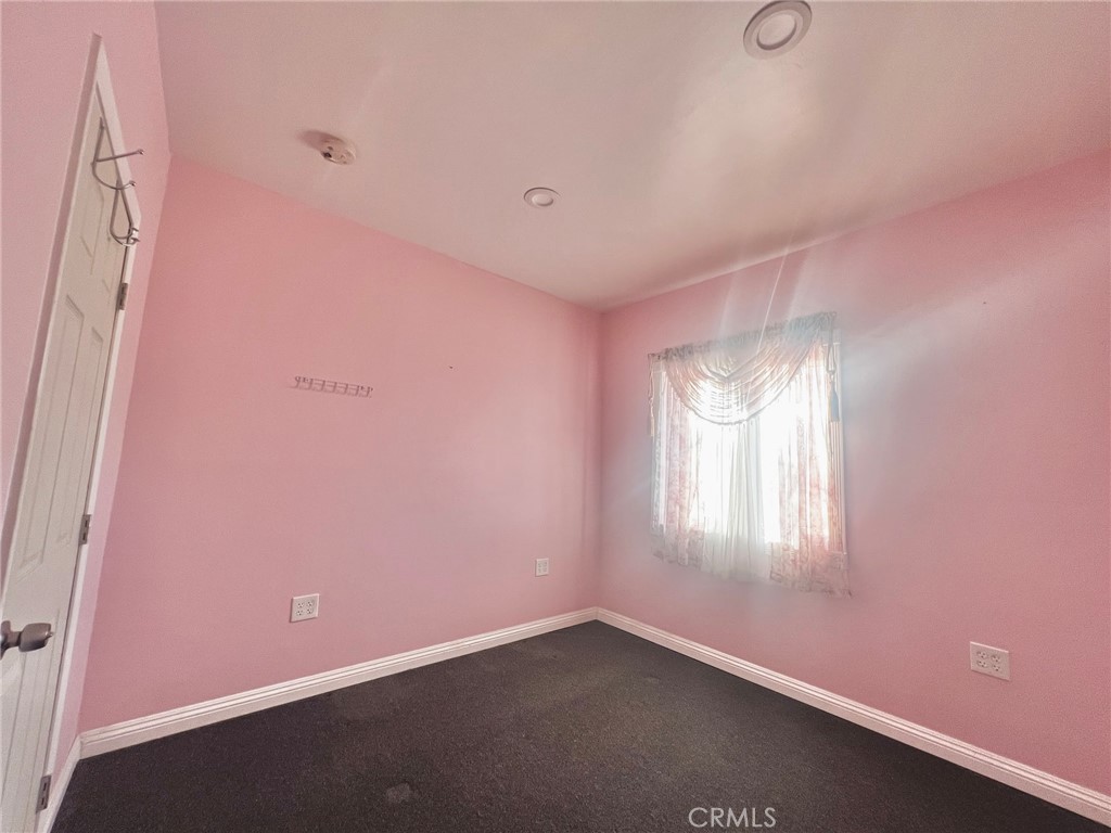 1166 El Mirage Road Adelanto, CA 92301 - Photo 18 of 21 an empty room with windows and closet