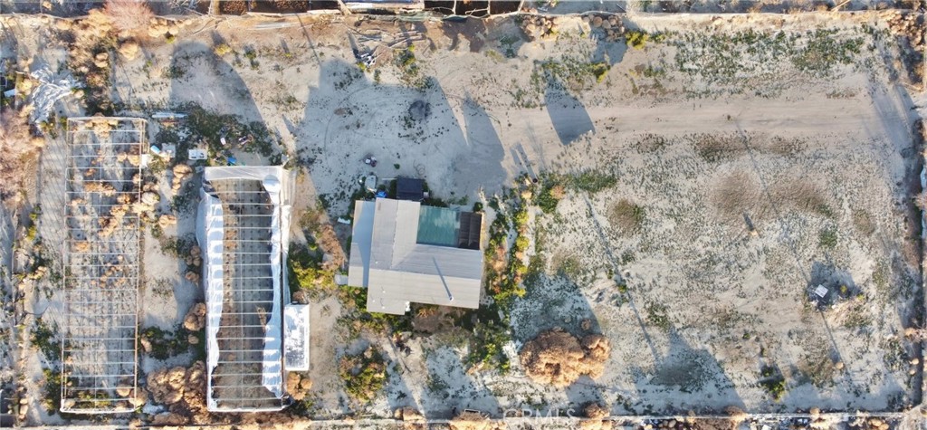 1166 El Mirage Road Adelanto, CA 92301 - Photo 20 of 21 a aerial view of a house with a yard