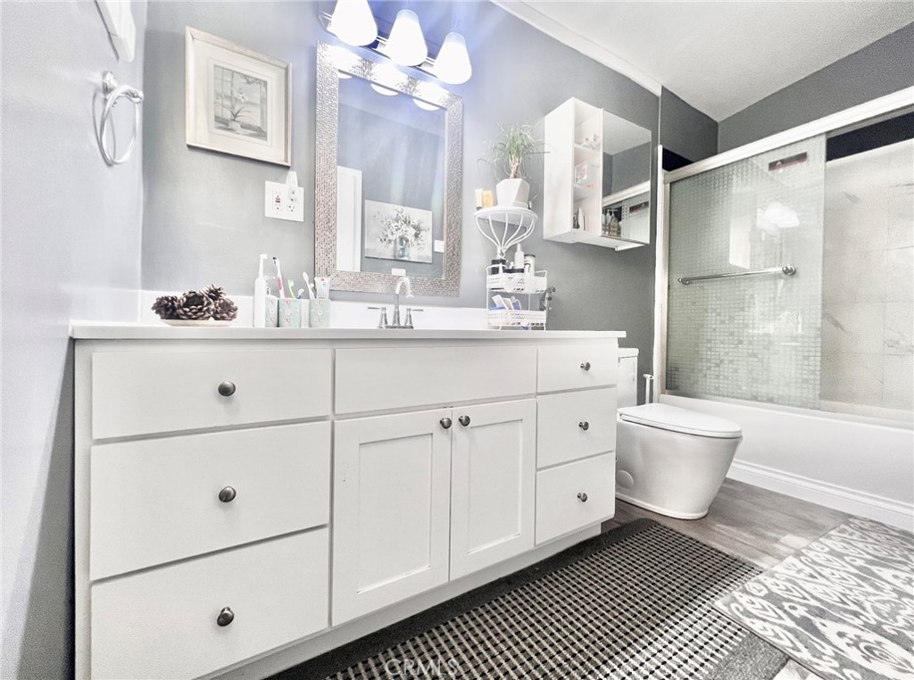 1166 El Mirage Road Adelanto, CA 92301 - Photo 9 of 21 a spacious bathroom with a double vanity sink a toilet a mirror and shower